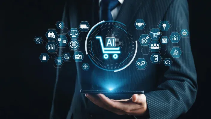 Icono de carrito de compra con inteligencia artificial sobre una tablet sostenida por un profesional, representando el comercio digital automatizado.
