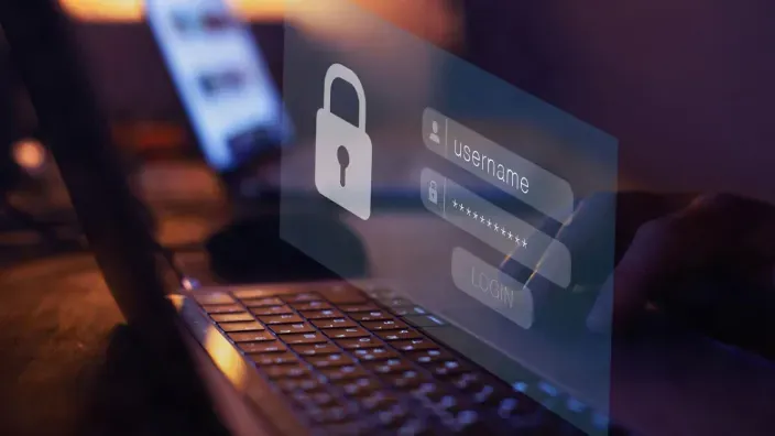 Pantalla de inicio de sesión superpuesta sobre un ordenador portátil