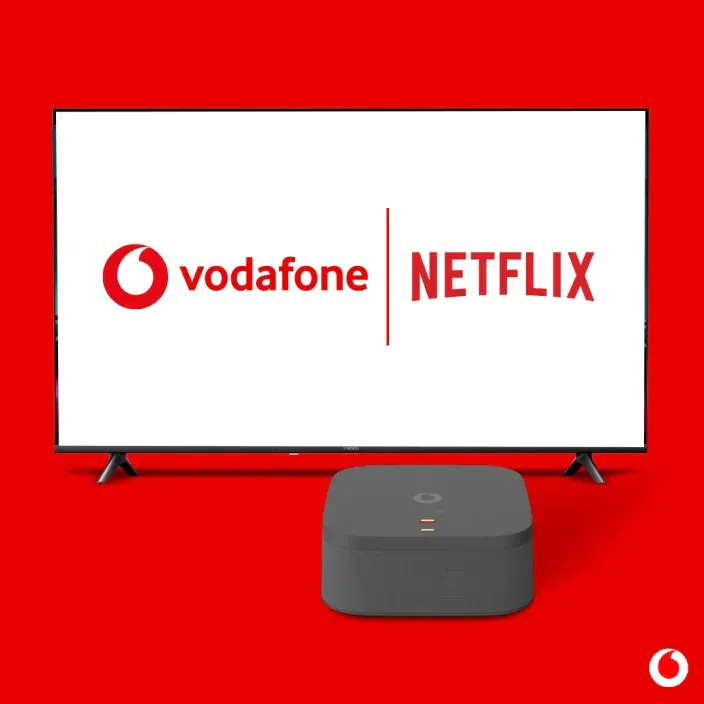 Netflix en Vodafone TV: logos en pantalla de televisión junto al decodificador oficial de la operadora.