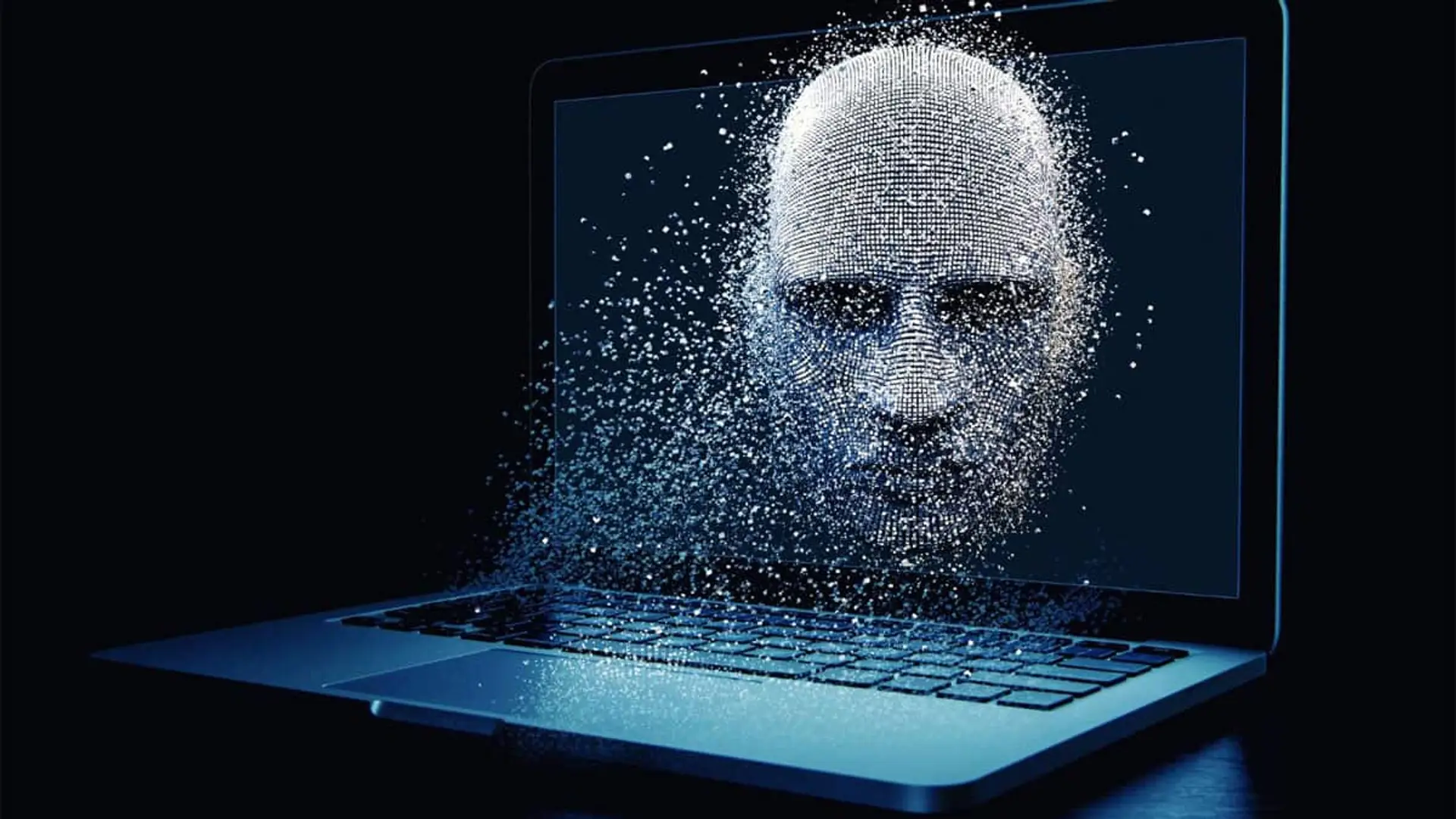 Rostro digital formado por puntos saliendo de la pantalla de un ordenador portátil