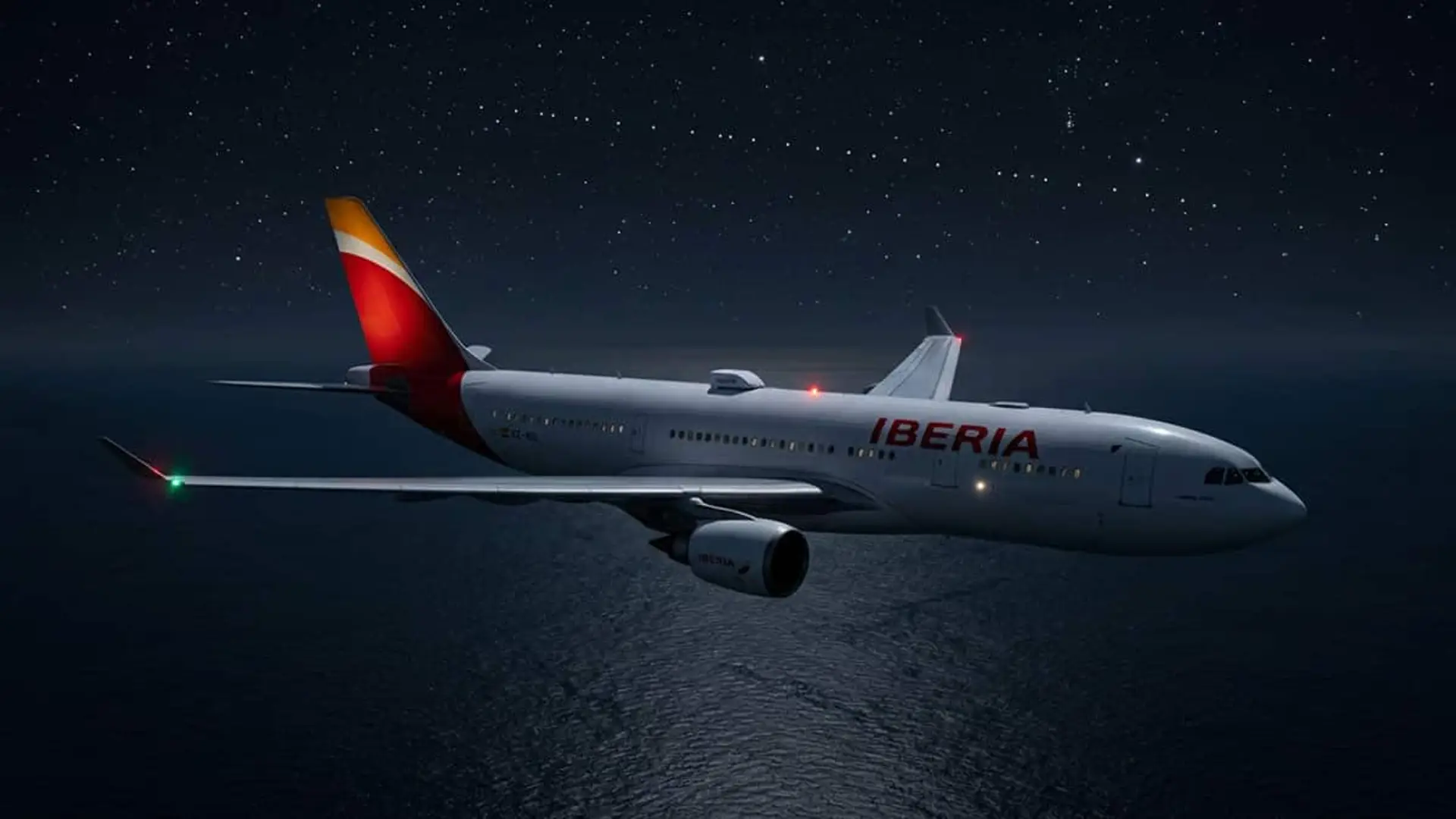 Avión de Iberia volando de noche sobre el mar bajo un cielo estrellado