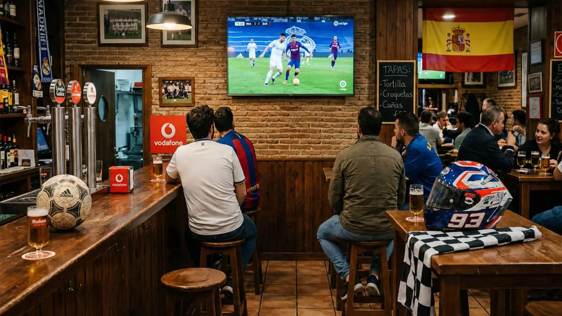Bar deportivo en Madrid con aficionados viendo un partido de fútbol en pantalla grande.