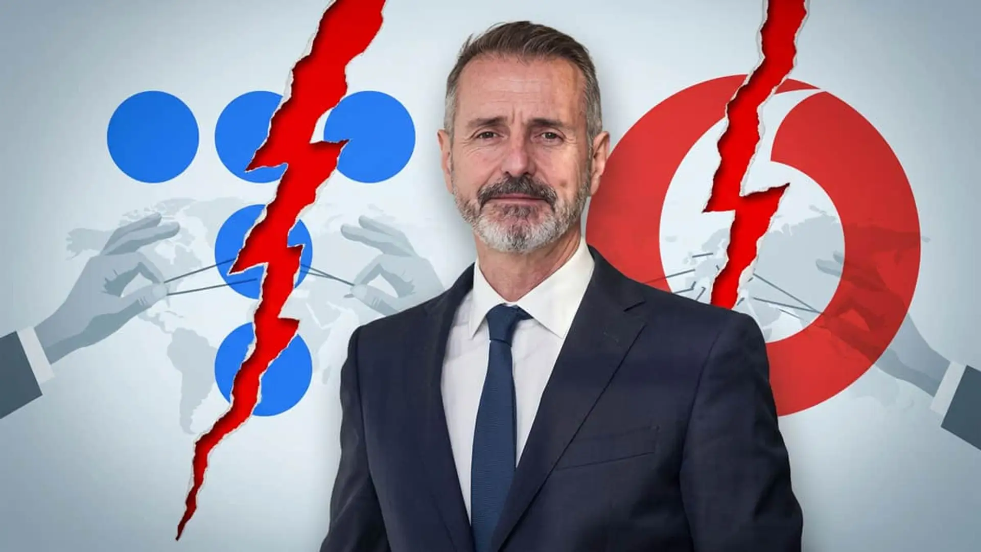 Marc Mutra frente a los logos de Telefónica y Vodafone divididos por grietas ante la falta de acuerdo comercial.