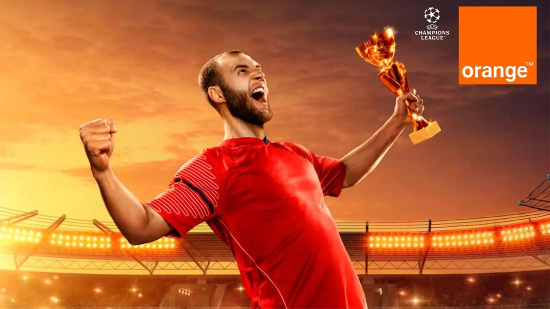 Futbolista celebrando con un trofeo junto a los logos de Orange y la Champions League.