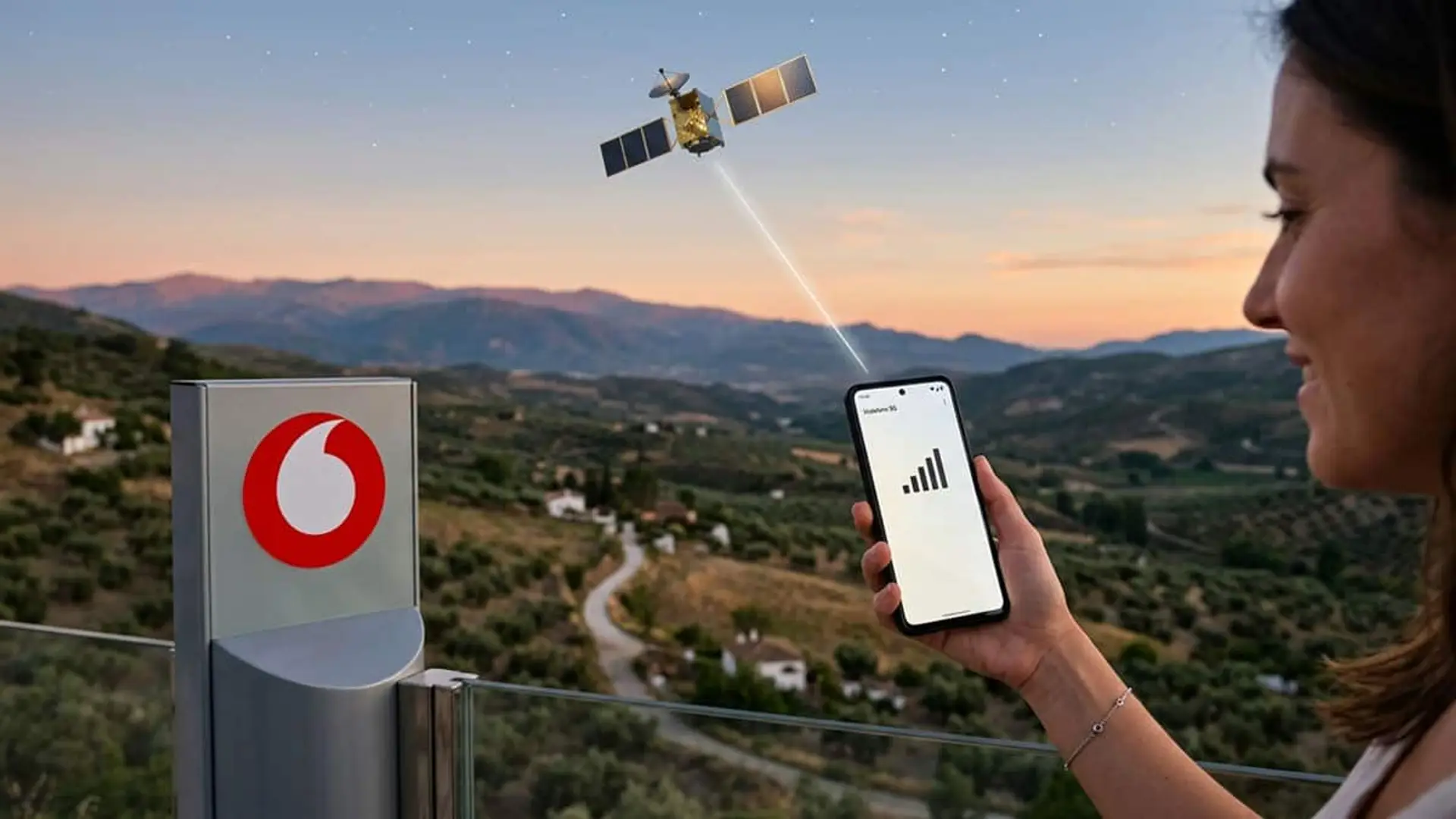 Persona sosteniendo un móvil con señal de cobertura junto a un dispositivo de Vodafone y un satélite sobre un paisaje rural