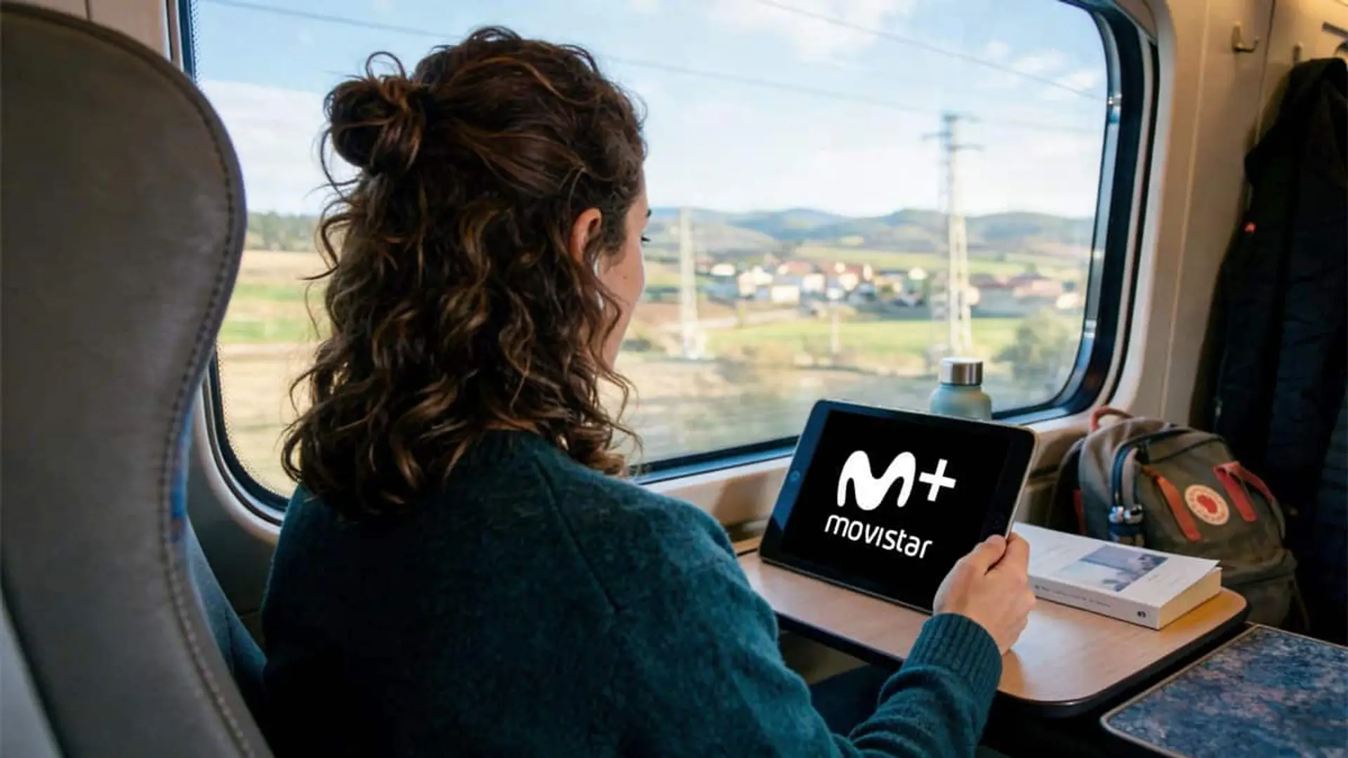 Movistar Plus+ gana a Netflix y acapara la mitad del Top 10 de cine en marzo: “Los domingos” lidera por segundo mes seguido Persona sentada en un tren viendo Movistar Plus en una tablet junto a la ventana