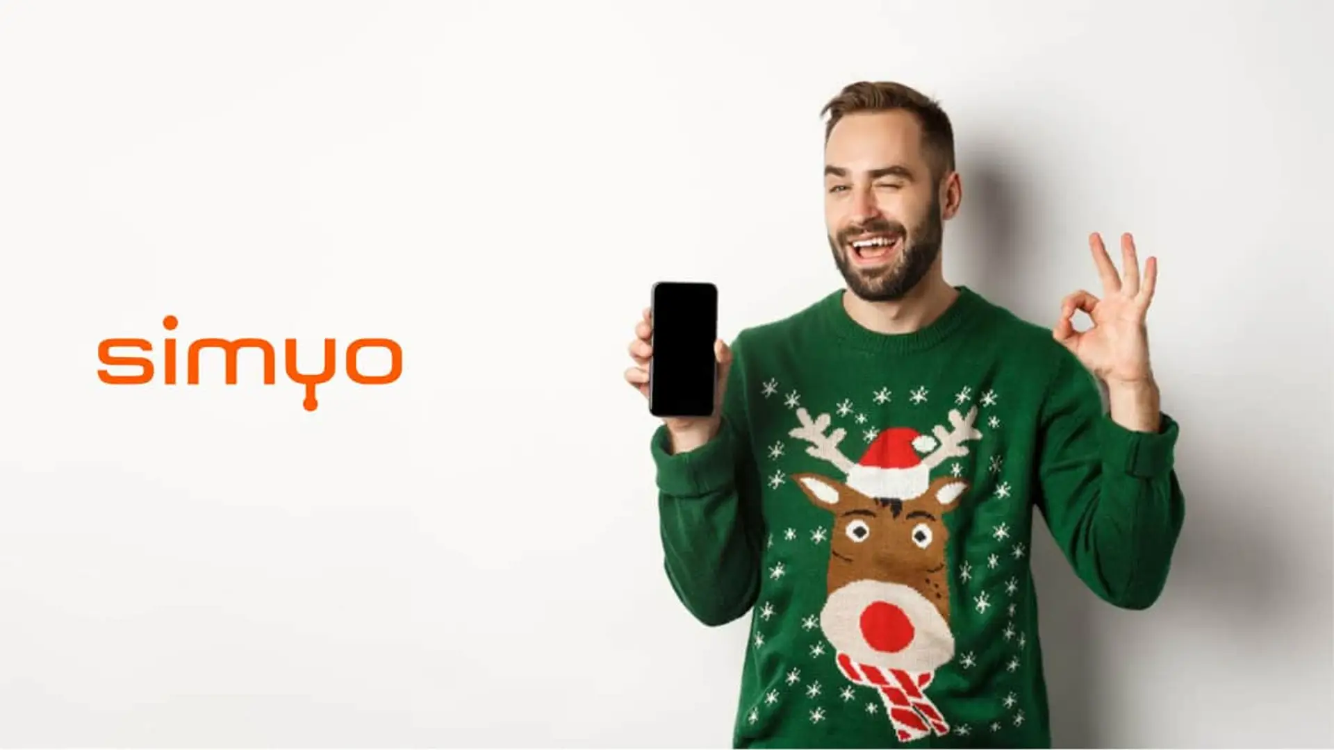 Simyo se adelanta a la Navidad con 100GB gratis para sus clientes: así puedes conseguirlos Cliente de simyo satisfecho con su tarifa móvil, mostrando un smartphone durante la campaña de Navidad.