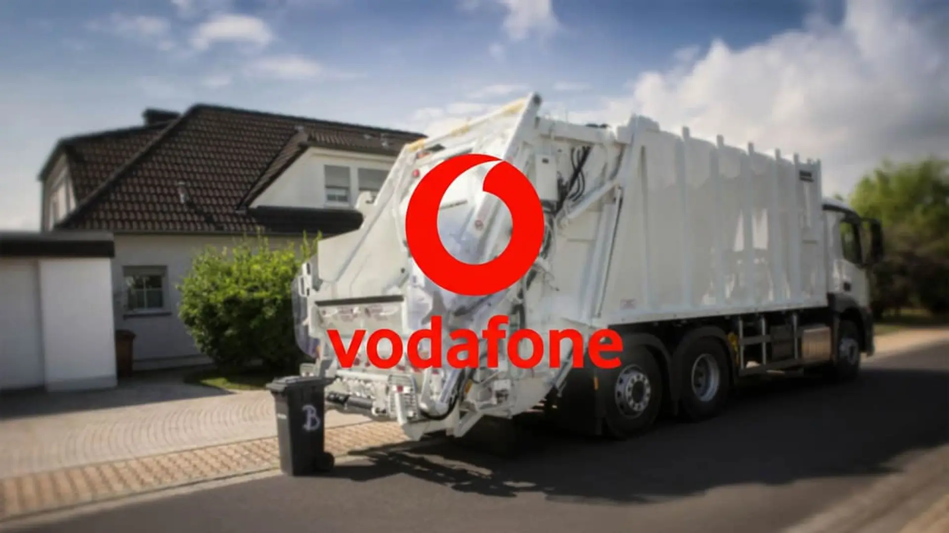 Camión de basura con logo de Vodafone: tecnología para la gestión inteligente y conectada de residuos urbanos.